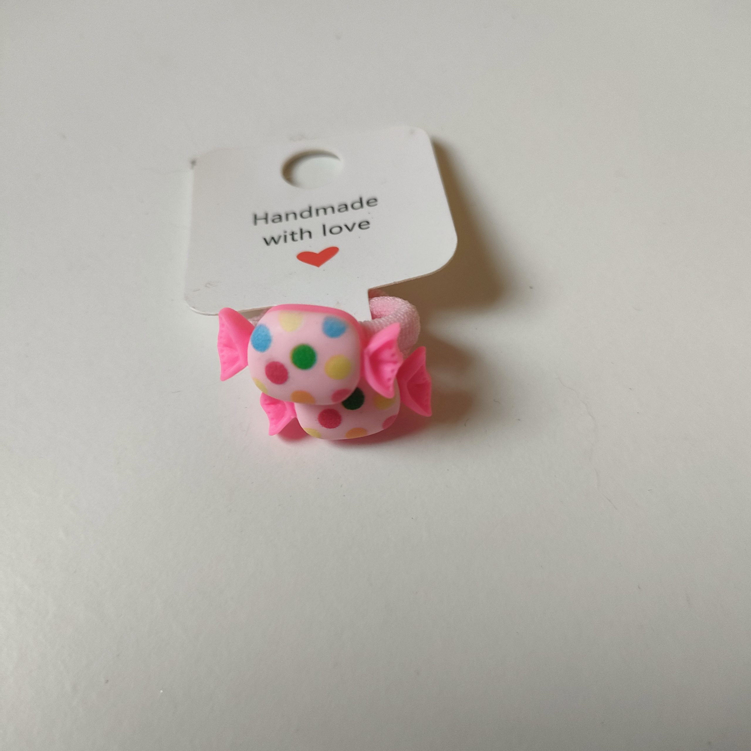 roze stipjes elastiekje snoepje
